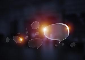 Speech bubbles float on a dark background.