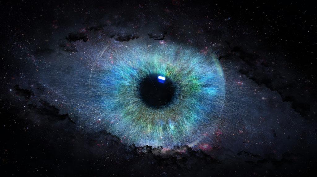 A bright blue eye on a black background.